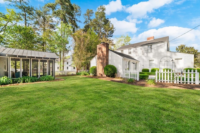 view of yard with a sunroom