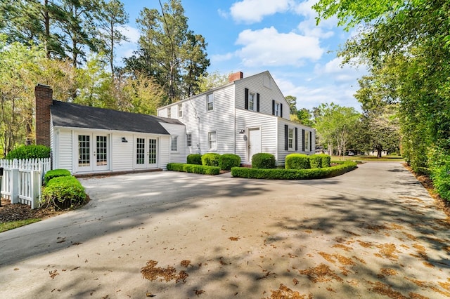 view of home's exterior featuring french doors