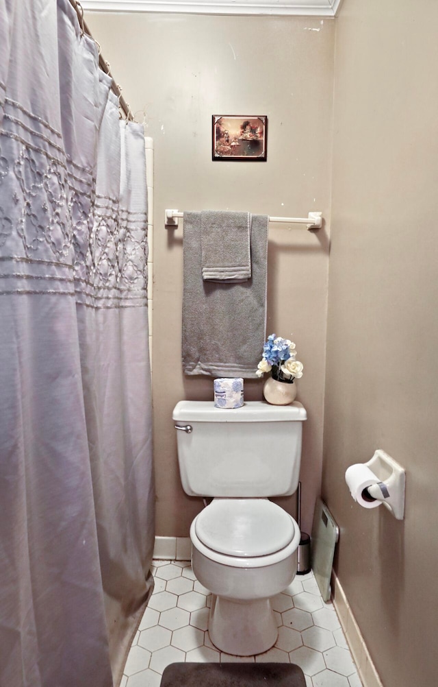 bathroom with tile patterned flooring and toilet