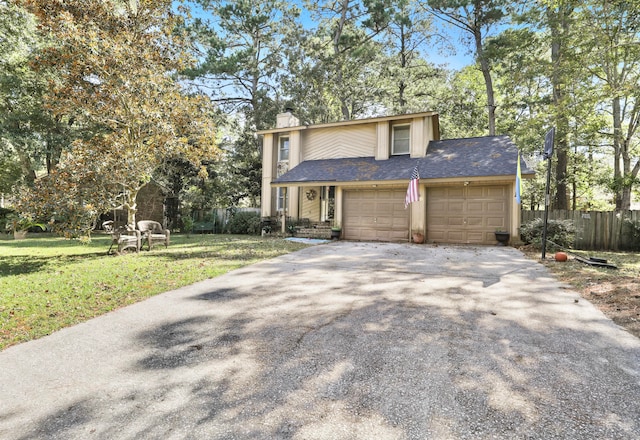 front of property with a garage and a front lawn