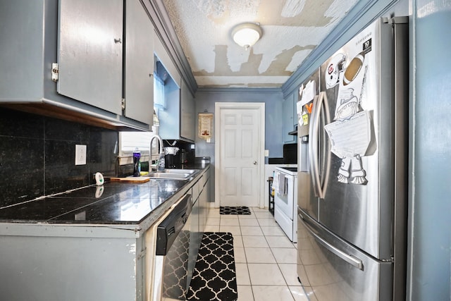 kitchen with light tile patterned floors, sink, ornamental molding, tasteful backsplash, and appliances with stainless steel finishes