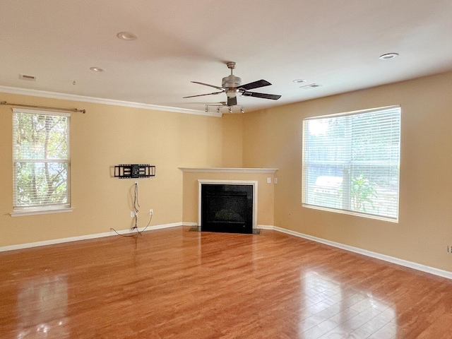 3632 Locklear Ln, Mount Pleasant, SC 29466 - unfurnished living room featuring wood finished floors, a fireplace, crown molding, a ceiling fan, and recessed lighting