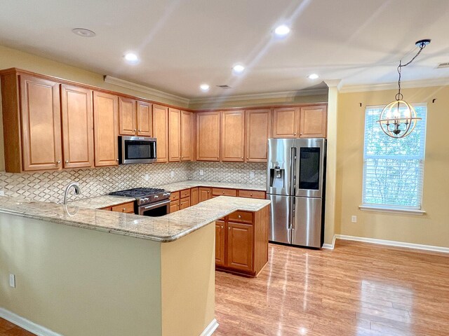 3632 Locklear Ln, Mount Pleasant, SC 29466 - kitchen with appliances with stainless steel finishes, crown molding, light stone counters, tasteful backsplash, and baseboards