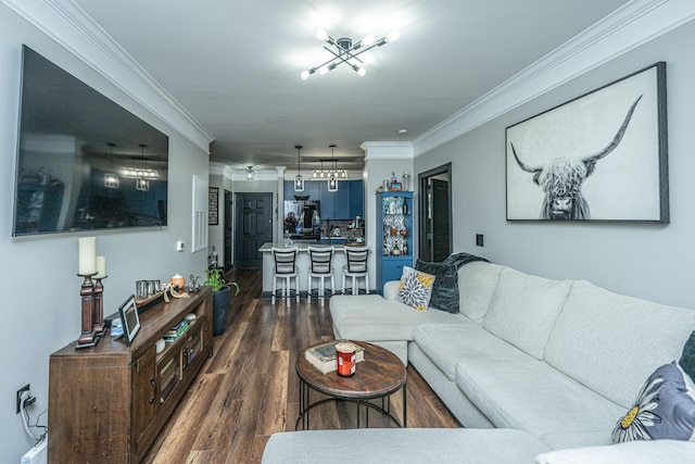 living room with a chandelier, crown molding, and dark hardwood / wood-style floors