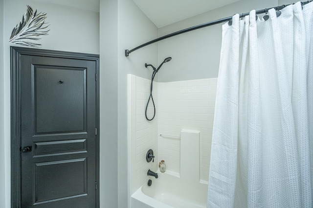 bathroom featuring shower / bath combo with shower curtain