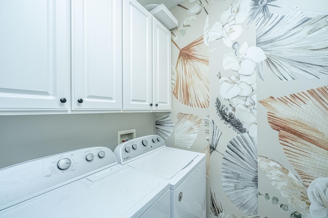 laundry room featuring cabinets and independent washer and dryer