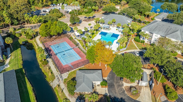 birds eye view of property with a water view