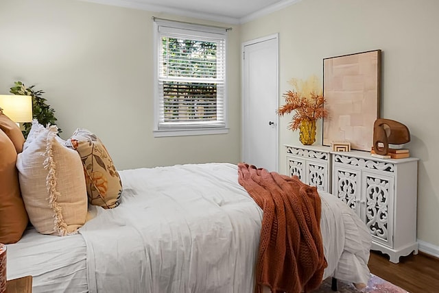 4810 Parkside Dr, North Charleston, SC 29405 - bedroom with wood finished floors, crown molding, and baseboards