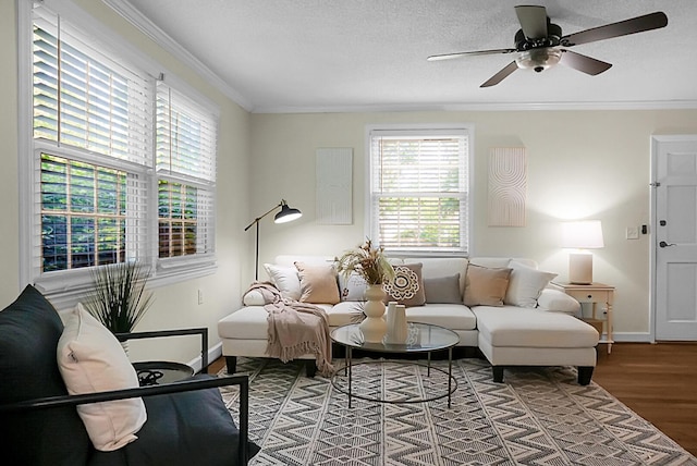 4810 Parkside Dr, North Charleston, SC 29405 - living room with healthy amount of natural light, wood finished floors, crown molding, ceiling fan, and baseboards