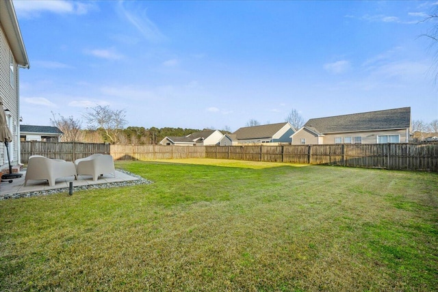view of yard with a fenced backyard and a patio