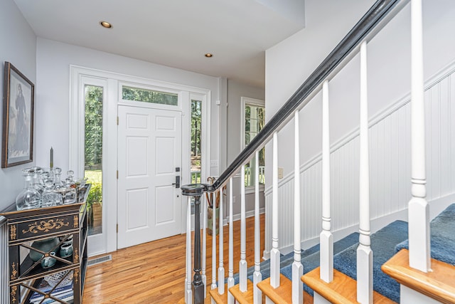 foyer entrance with light hardwood / wood-style flooring