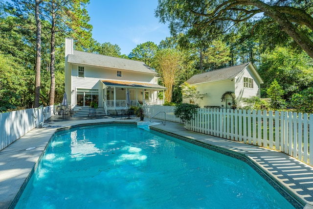 view of swimming pool featuring a patio area