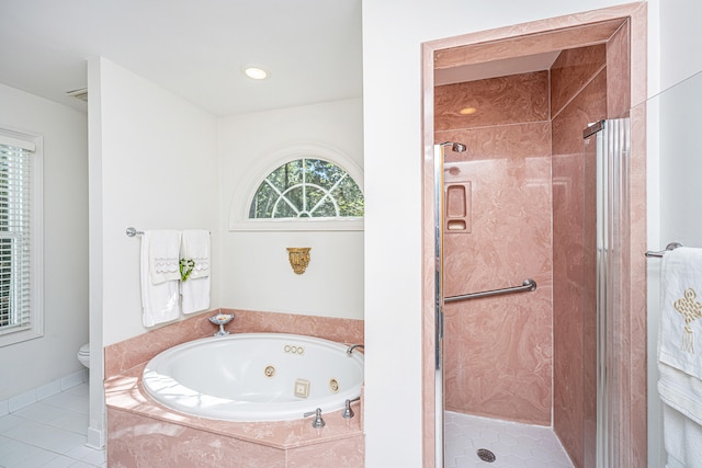 bathroom featuring independent shower and bath, tile patterned floors, and toilet