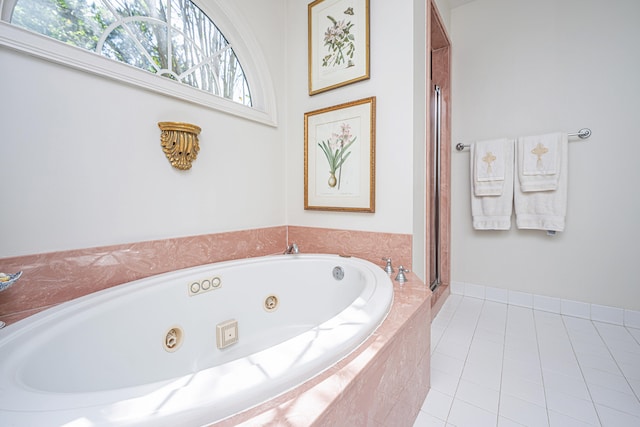 bathroom featuring a relaxing tiled tub