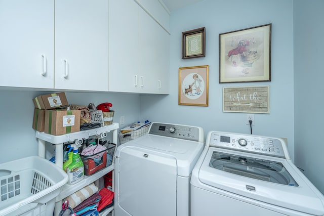 laundry room featuring cabinets and independent washer and dryer