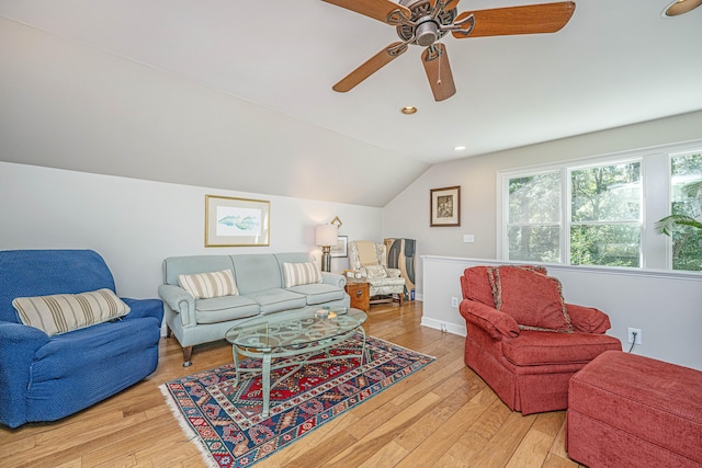 living room featuring light wood-type flooring, lofted ceiling, and ceiling fan