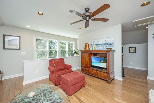 sitting room featuring lofted ceiling, ceiling fan, and light hardwood / wood-style flooring