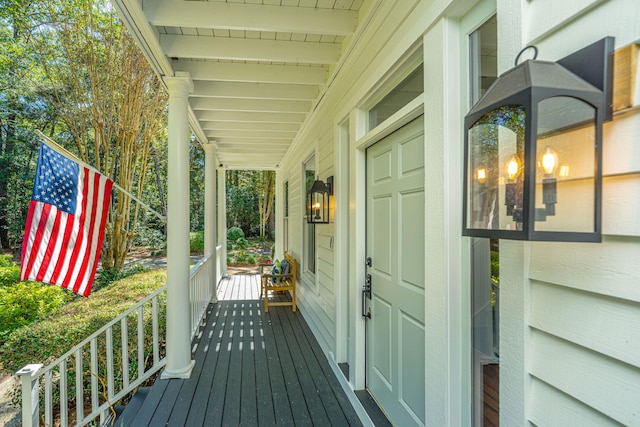 wooden deck featuring covered porch