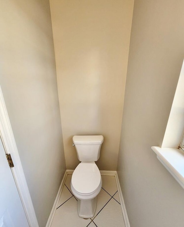 bathroom featuring tile patterned floors and toilet