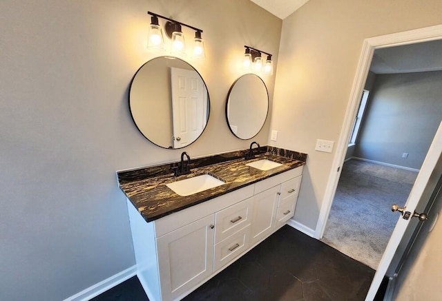 bathroom with tile patterned floors and vanity