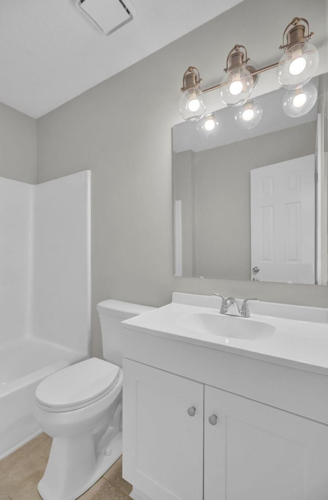 bathroom with tile patterned floors, vanity, and toilet