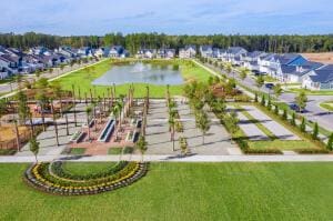 drone / aerial view featuring a water view and a residential view