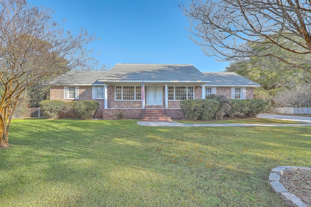 single story home featuring a front lawn