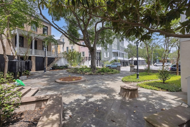 view of property's community featuring stairway, a residential view, and mail area
