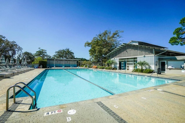 community pool featuring a patio area