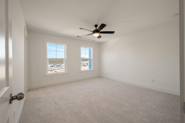 410 Katies Scenic Ct, Charleston, SC 29492 - unfurnished room with light colored carpet, baseboards, a ceiling fan, and visible vents
