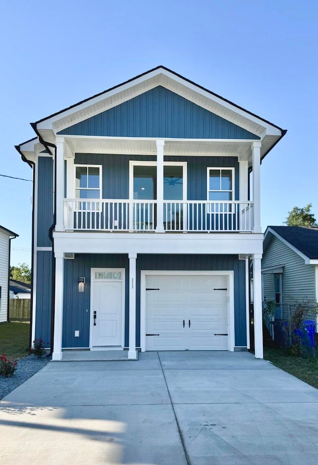 view of front facade with a garage and a balcony