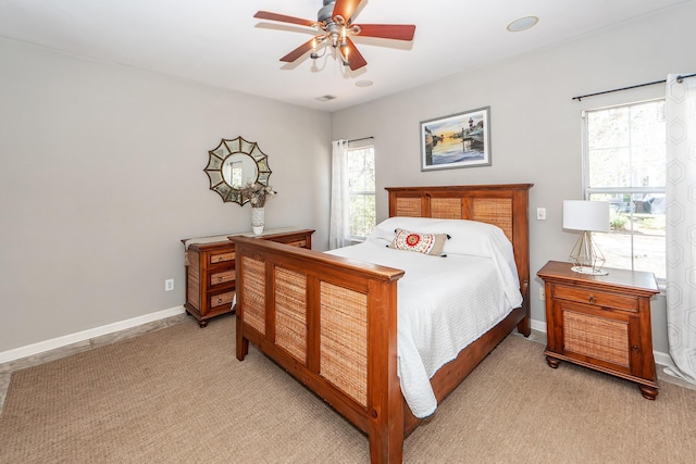 bedroom with baseboards, light carpet, and ceiling fan