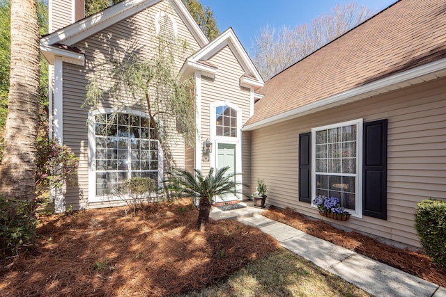 property entrance featuring a chimney