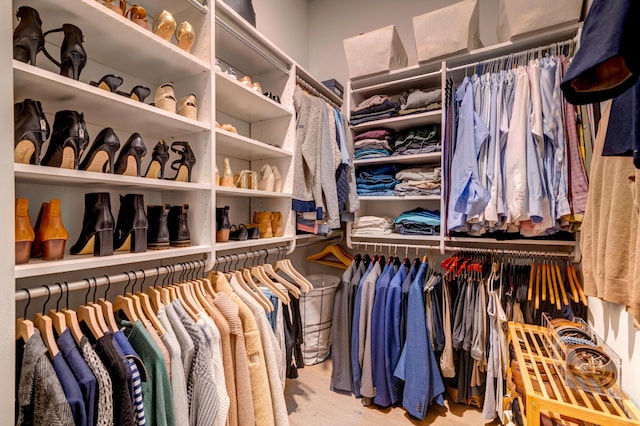 walk in closet featuring light hardwood / wood-style floors