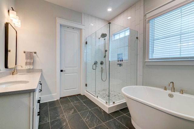 bathroom with vanity and plus walk in shower