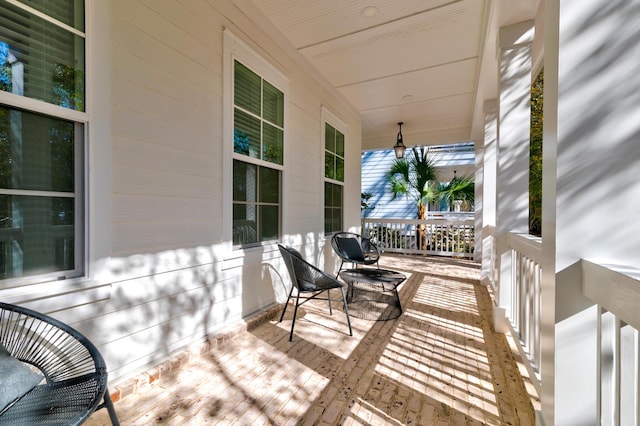 wooden terrace featuring a porch