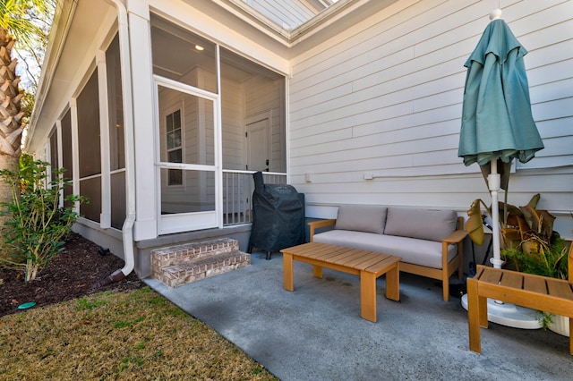 view of patio / terrace featuring area for grilling and a sunroom