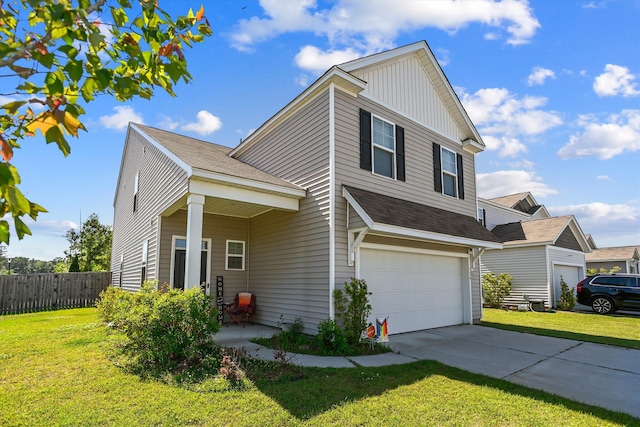 traditional-style home featuring fence, an attached garage, a front lawn, and concrete driveway