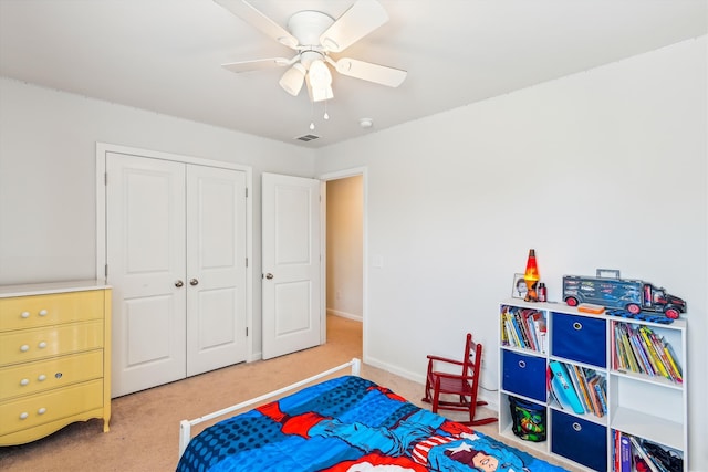 carpeted bedroom with baseboards, a ceiling fan, visible vents, and a closet
