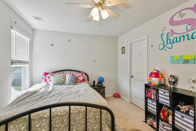 bedroom with carpet floors, visible vents, a ceiling fan, and baseboards