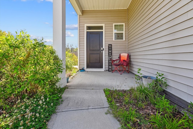doorway to property with covered porch