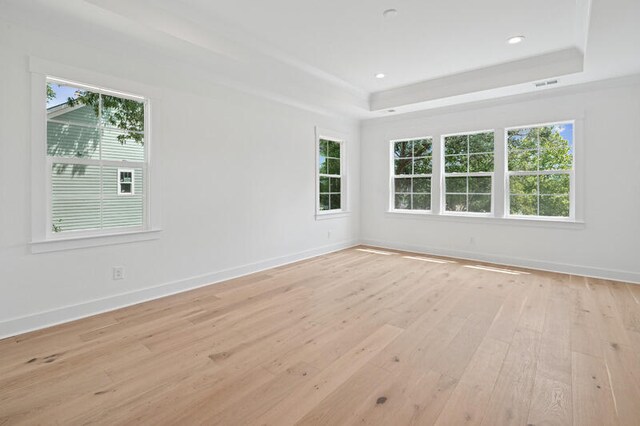 2006 Riverbend Dr, Charleston, SC 29412 - empty room with a raised ceiling, light wood-style flooring, baseboards, and recessed lighting