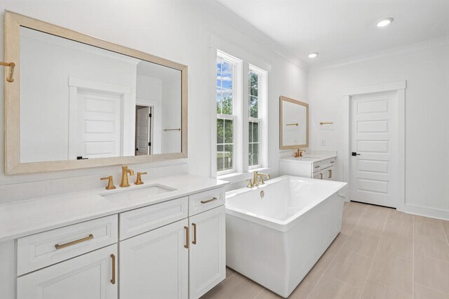 2006 Riverbend Dr, Charleston, SC 29412 - bathroom with vanity, a freestanding tub, crown molding, and recessed lighting