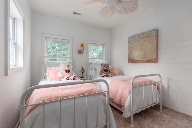 1532 Sea Palms Cres, Mount Pleasant, SC 29464 - bedroom with a ceiling fan and wood walls