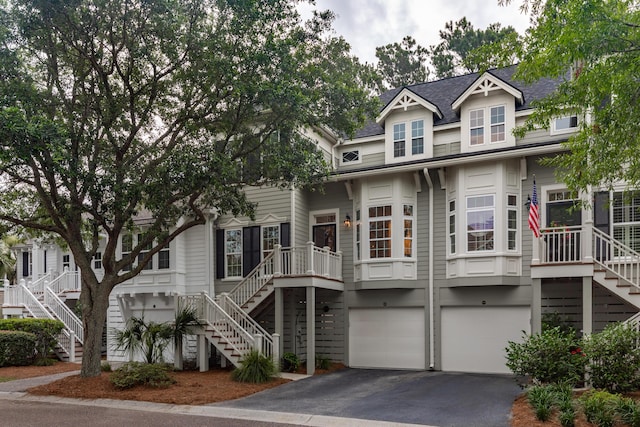 1532 Sea Palms Cres, Mount Pleasant, SC 29464 - view of front of house with stairway, an attached garage, driveway, and roof with shingles