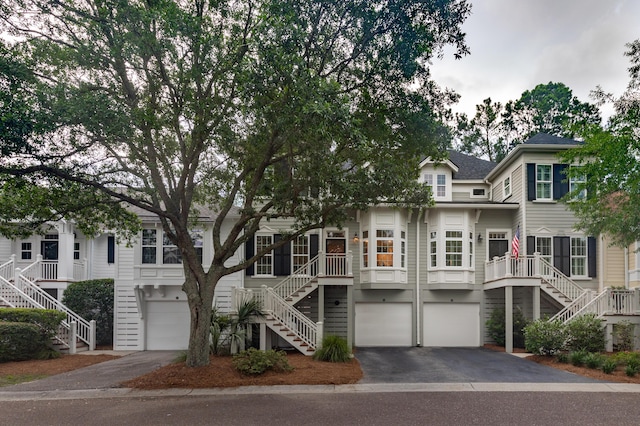 1532 Sea Palms Cres, Mount Pleasant, SC 29464 - view of front of property featuring stairway, a garage, and asphalt driveway
