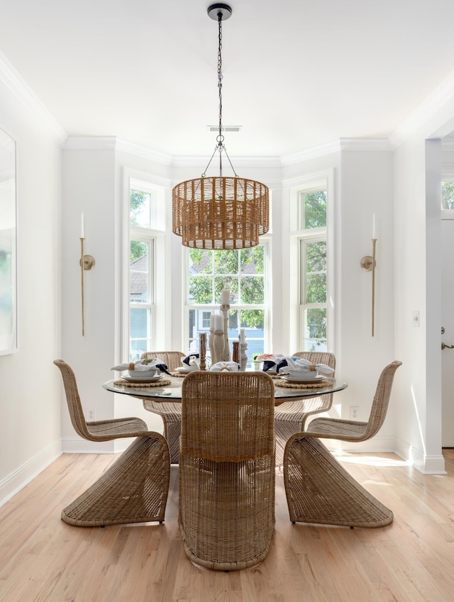 1532 Sea Palms Cres, Mount Pleasant, SC 29464 - dining area with crown molding, healthy amount of natural light, wood finished floors, and breakfast area