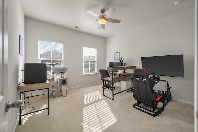 office featuring light carpet and ceiling fan