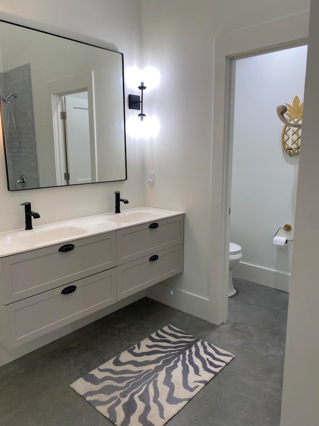 bathroom with concrete flooring, a shower, vanity, and toilet