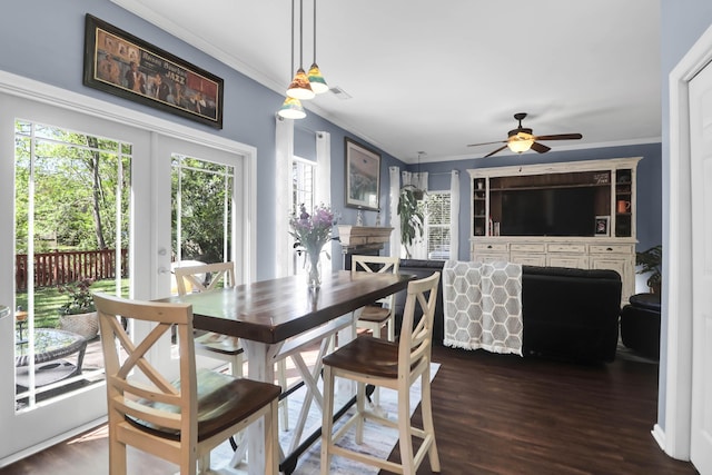 dining area featuring ornamental molding, ceiling fan, and dark wood-style floors